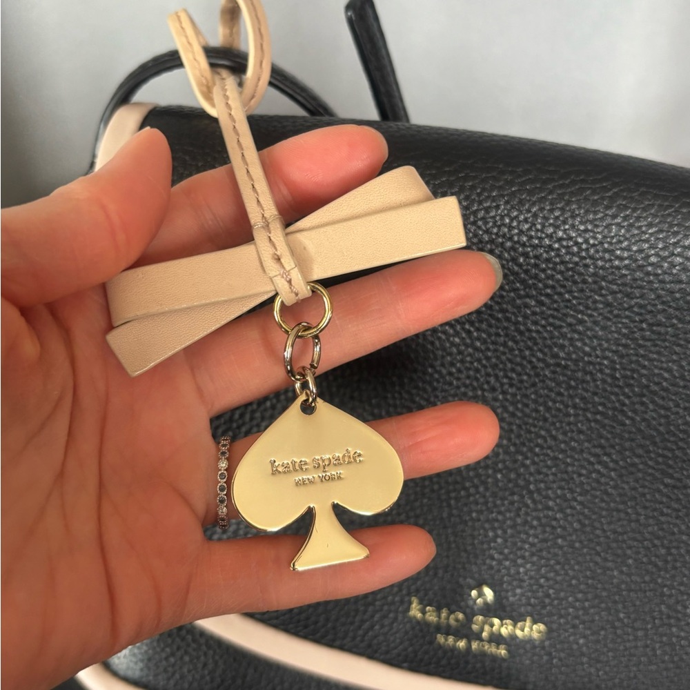 Kate Spade beige Cream leather with signature spade metal bag charm